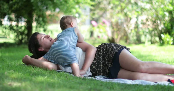 Candid Mother Interaction Baby Mom Biting Caring Infant Toddler Outdoors — стоковое фото