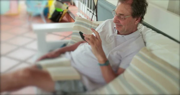 Older Retired Man Checking Cellphone Balcony — Zdjęcie stockowe