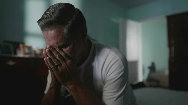 stock image Desperate senior man covering face suffering from despair and lonliness. Older middle-aged person covering face in shame, struggling with anxiety and mental illness