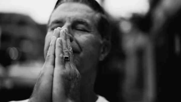 stock image Religious Senior Man in Contemplation, Eyes Closed in Prayer, Expressing Gratitude and Spirituality in Monochrome Black and White