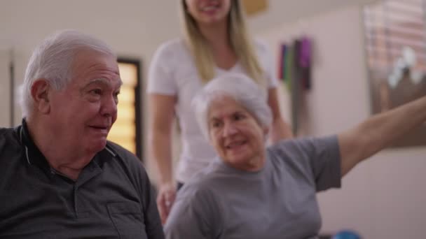Senior Couple Bonding Sport Pilates Class Guided Female Coach Passing — 비디오
