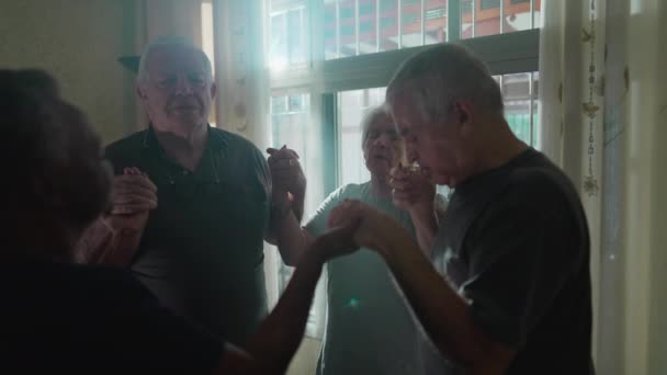 Hopeful Elderly Prayer Home Holding Hands Group Faithful Seniors Eyes — Stock Video