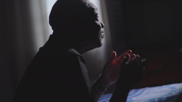 Religious African American Senior Man Kneeling Bedside Praying God Asking — Stock Video