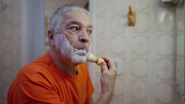 Elderly Man Applying Shaving Foam Morning Beard Grooming Routine Bathroom — Stock Photo, Image