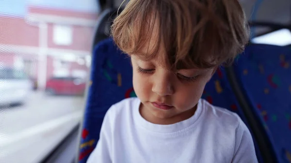 stock image One pensive passenger child traveling by public transportation thoughtful little boy traveling