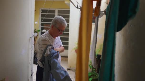 Senior Man Reverting Pants Out Drying Hanger Older Person Doing — Stock video