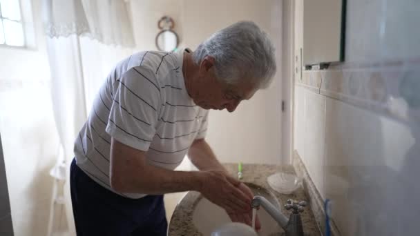 Senior Man Morning Routine Washing Face Brushing Teeth Front Mirror — Stock Video