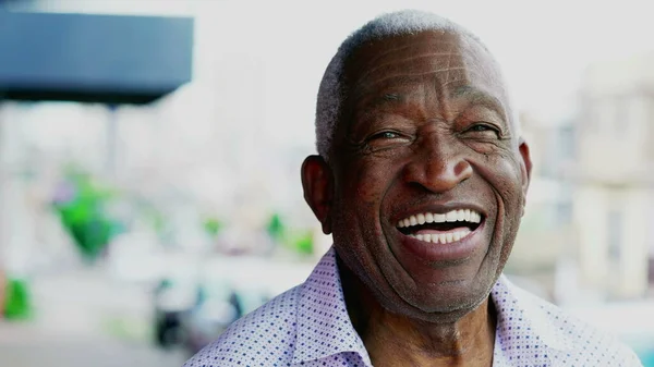One joyful black older Brazilian person smiling. Charismatic Elderly African American close-up face with friendly disposition
