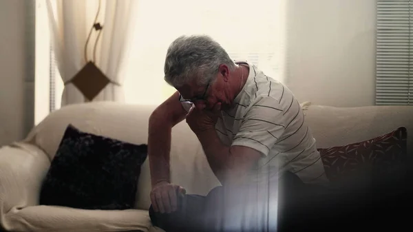 stock image Anxious neurotic elderly senior man struggles with preoccupation and worry at home alone. Quiet despair in old age concept, suffering from mental illness and the aging process