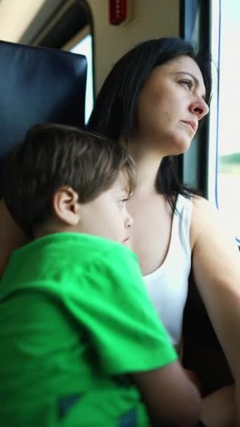 Pensive Mother Child Traveling Train Staring Window View Lost Thought — Stock Video