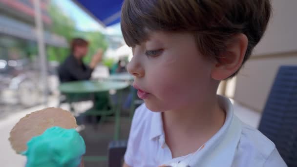 Little Boy Savors Ice Cream Cone Summer Day Child Licking — Stock Video