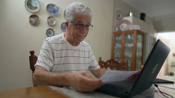 Worried Senior Man Looking Fine Paper Front Laptop Computer Complaining — Stock Photo, Image