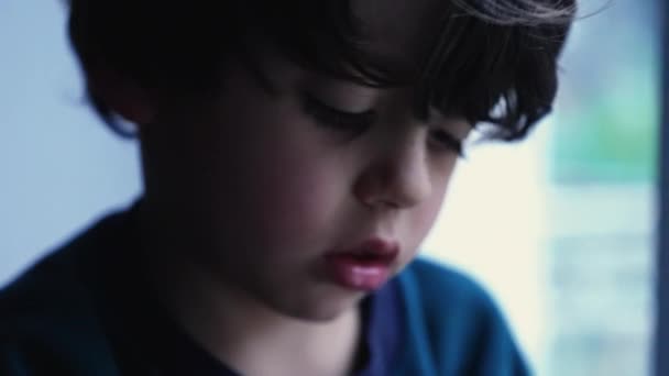 Child Sitting Window Home Night Gloomy Expression Feeling Loneliness Melancholic — Stock Video