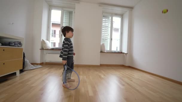 Small Boy Practicing Tennis Home Wall Empty Bedroom Child Hitting — Stock Video