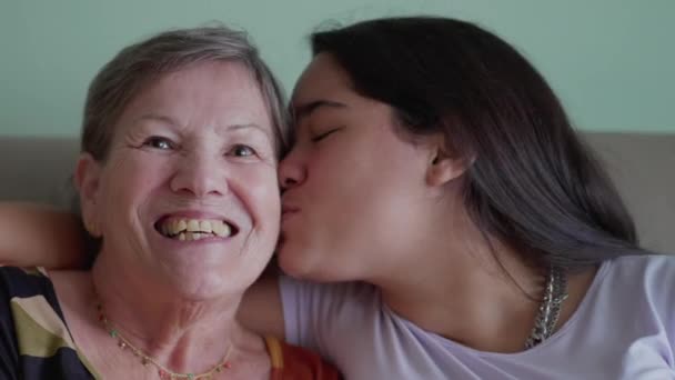 Asian Brazilian Granddaughter Kissing Caucasian Grandmother Cheek Arm Shoulder Heartfelt — Stock Video