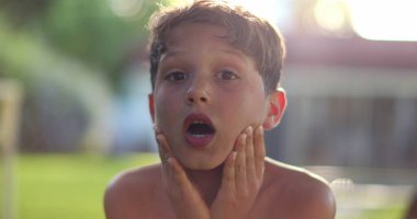 Child boy SHOCK reaction with despair. Emotional kid reacting with confusion