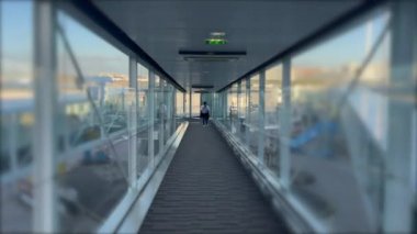 Passenger POV inside plane boarding bridge. Traveling flight concept transportation.