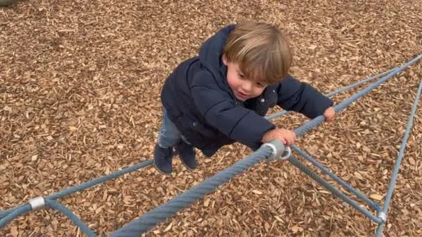 One Little Baby Boy Climbing Playground Structure Role Winter Season — Stock video