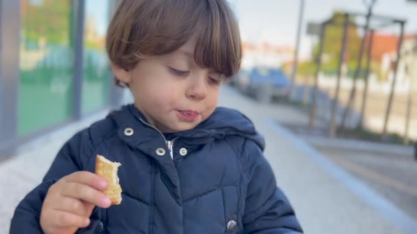 One Cute Little Boy Eating Cookie Standing Street Portrait Child — Vídeos de Stock