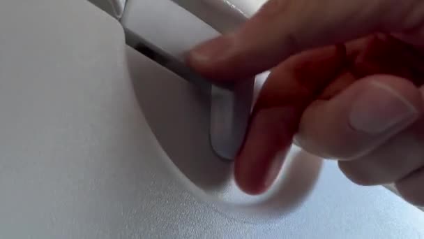 Closeup Hand Opening Closing Plane Tray Table — Stockvideo