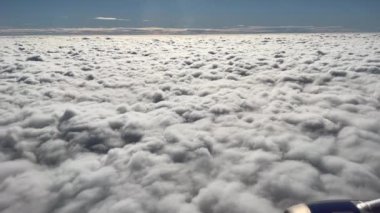 Clouds seen from plane window. sky as seen through window of an aircraft. Flight concept landscape