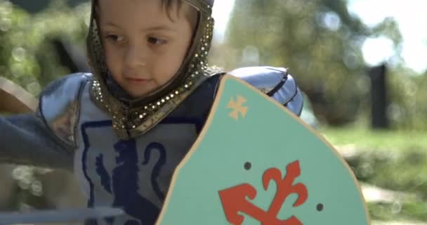 Little Boy Wearing Traditional Medieval Costume Hitting Sword Holding Shield — Stock Video