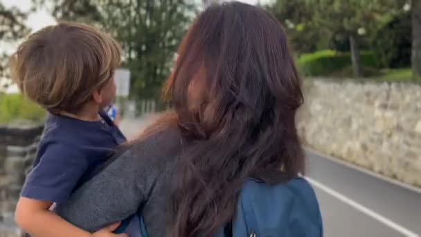 Back Mother Carrying Child Arms Walking Countryside Road Happy Little — Stockvideo