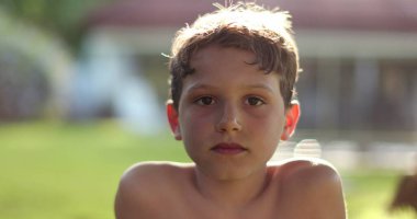 Young boy astonished surprise SHOCK reaction. Child reacting to news, exaggerated expression