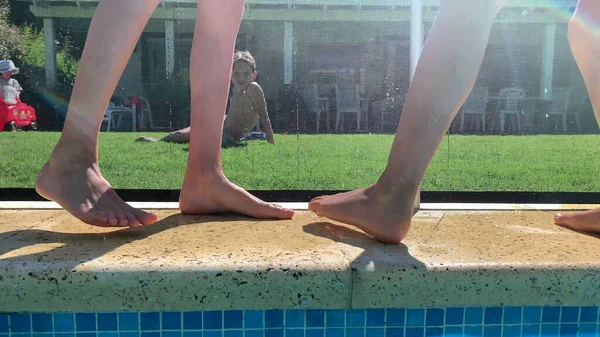 Children Legs Poolside Pulling Each Other Quarreling Playing Activity — Stock Photo, Image