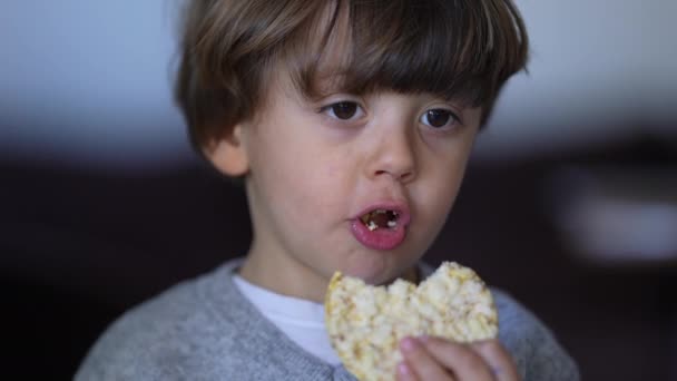 Small Boy Eating Cracker Close Face Caucasian Child Snacking Rice — Stock Video