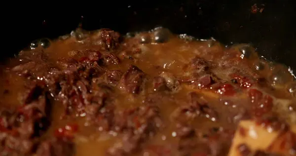 Cooking osso buco meet inside pan. braised veal food close-up