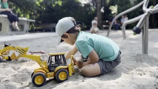 Little Boy Having Fun Toy Tractors Sand Play Playground Radość — Wideo stockowe