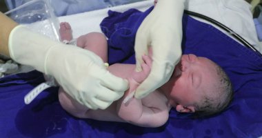 Birth of baby infant crying, first seconds of life