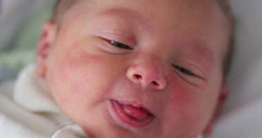 Closeup of infant newborn baby