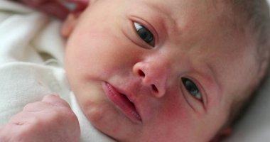 Infant newborn baby closeup face
