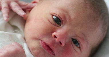 Infant newborn baby closeup face