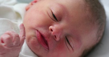 Close-up of baby face in first day of life