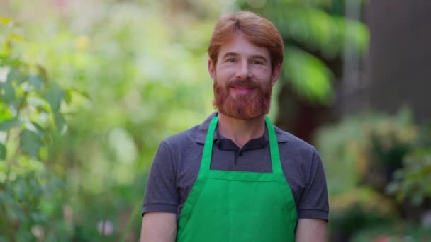 Portrait Caucasian Redhead Male Person Wearing Green Apron Smiling Camera — Stock Video