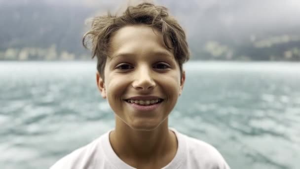 Adolescent Dental Braces Close Smile Lakeside Cloudy Day Mountain Backdrop — Stock Video