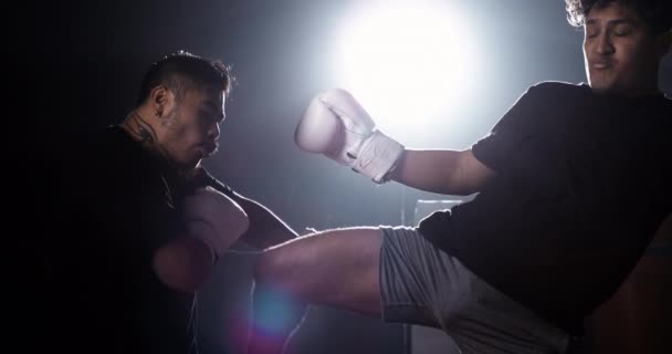 Muay Thai Fighter Kicking Opponent Side Boxing Ring Dramatic Lighting — Stock Video