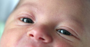 Little newborn baby macro eyes