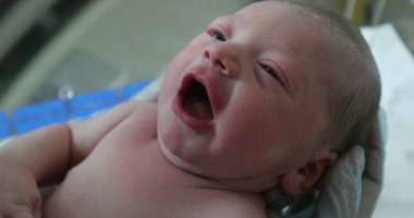 Newborn baby infant at hospital in first hours of life