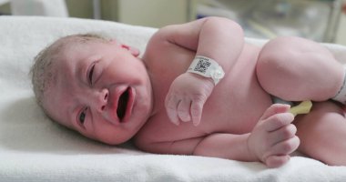 Newborn baby infant crying, first minutes of life of person
