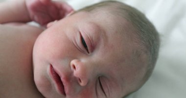 Newborn baby boy at hospital first day of life