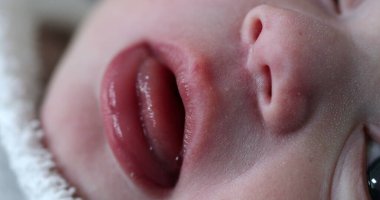 Macro close-up of newborn baby face