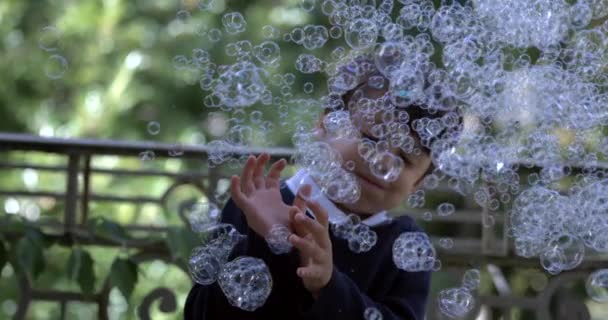 Happy Child Bedekt Met Duizenden Zeepbellen Super Slow Motion Vastgelegd — Stockvideo