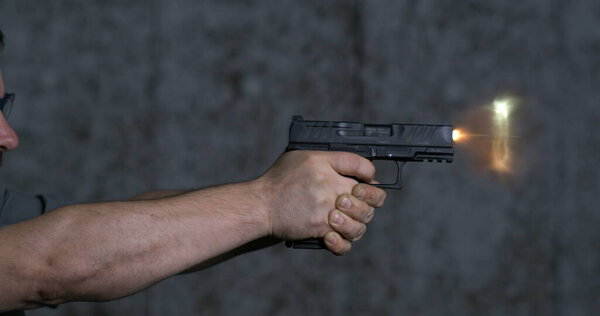 Close-up pistol Stoeger STR-9 Striker Fired 9mm, single shot at shooting range in super slow-motion 800 fps