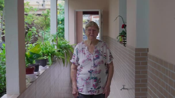 Portrait Senior Woman Standing Home Looking Camera Domesticity Lifestyle Scene — Stock Video