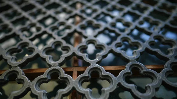 Elegant Metal gate patterns to fortify window protection in European traditional building