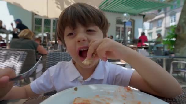 Young Pizza Lover Scene Small Boy Relishing Slice Restaurant Setting — Stock Video